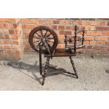 A late 19th century oak and beech spinning wheel, possibly Welsh,