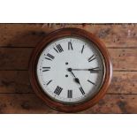 A late 19th century beech wall clock, with replaced Roman numeral dial and brass bezel,