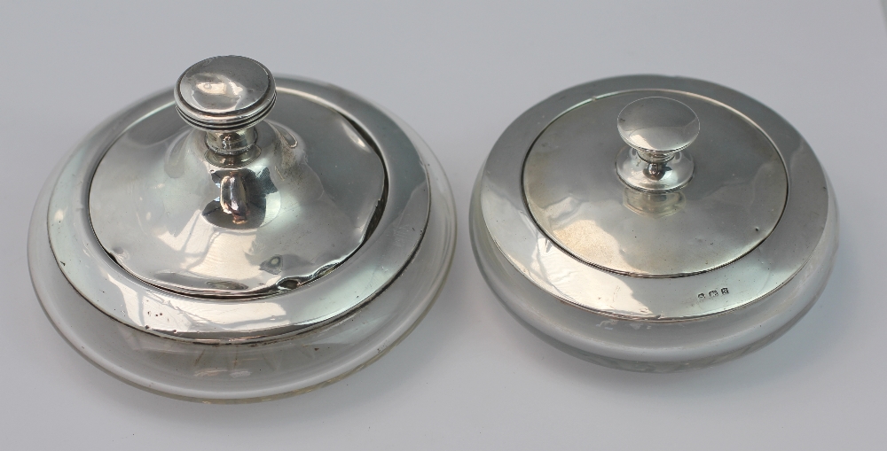 Two silver topped dressing table powder jars,