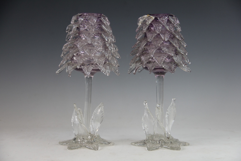 A pair of John Walsh glass tree vases, with amethyst glass body and clear glass detail, (as found),