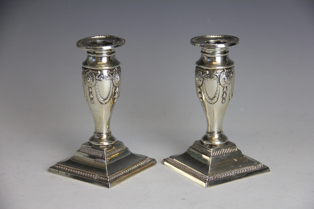 A pair of Edwardian silver candlesticks, Sheffield 1904,