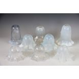 A collection of eight Victorian and Edwardian opaline and vaseline glass light shades,