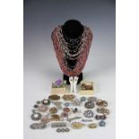 A collection of costume jewellery, to include; brooches, bangles, bracelets, beads,