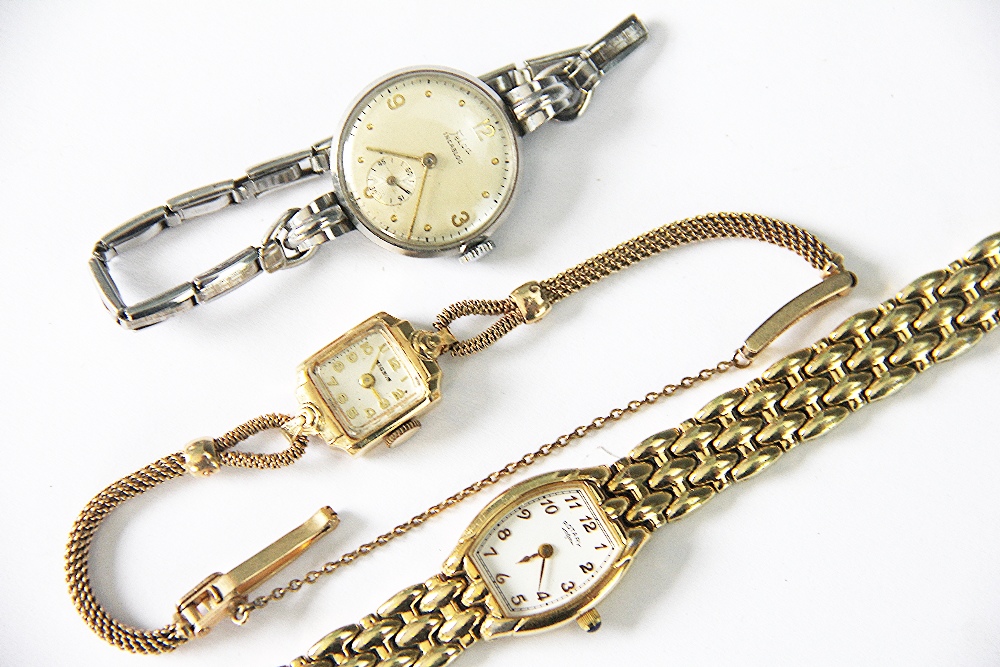 A lady's Mignon wristwatch, the square dial with Arabic numerals, reverse stamped '14k',