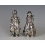 A pair of silver novelty condiments, early 20th century, designed as a little Dutch girl and boy,