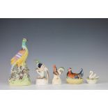 A collection of Staffordshire bird figures,