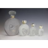 A graduated set of four Lalique for Nina glass scent bottles, to include a large display example,
