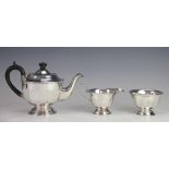 A silver three piece tea service, Viners Ltd, Sheffiled 1937, of faceted circular, pedestal form,