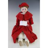 A porcelain head doll, early 20th century, the bisque head doll numbered '309.