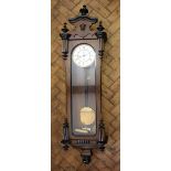 A walnut and ebony Vienna regulator, with enamel Roman numeral dial and subsidiary seconds,