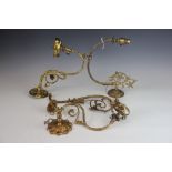 Three Art Nouveau brass wall lights, with foliate arms, longest 32cm,