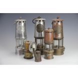 Three Protector Lamp and Lighting Co miners Davy lamps, including a Type SL and a Type 6 HMI,