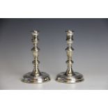 A pair of silver candlesticks, Roberts and Dore, London modern, each in George III baluster style,