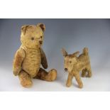 An English gold plush teddy bear, possibly Merrythought, 42cm, with a smaller dog soft toy,
