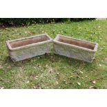 A pair reconstituted stone rectangular garden planters, with foliate detailing,