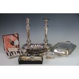 A large collection of silver plate to include a pair of candlesticks and assorted cutlery,