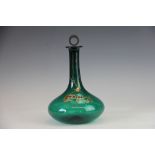A George III green glass onion shaped decanter and stopper, with gilt 'whisky' detail,