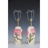 A pair of Moorcroft Pink Magnolia baluster form lamps, impressed marks, bases 16cm,