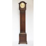 A 1920's oak eight day grandmother clock, with movement striking on five gongs,