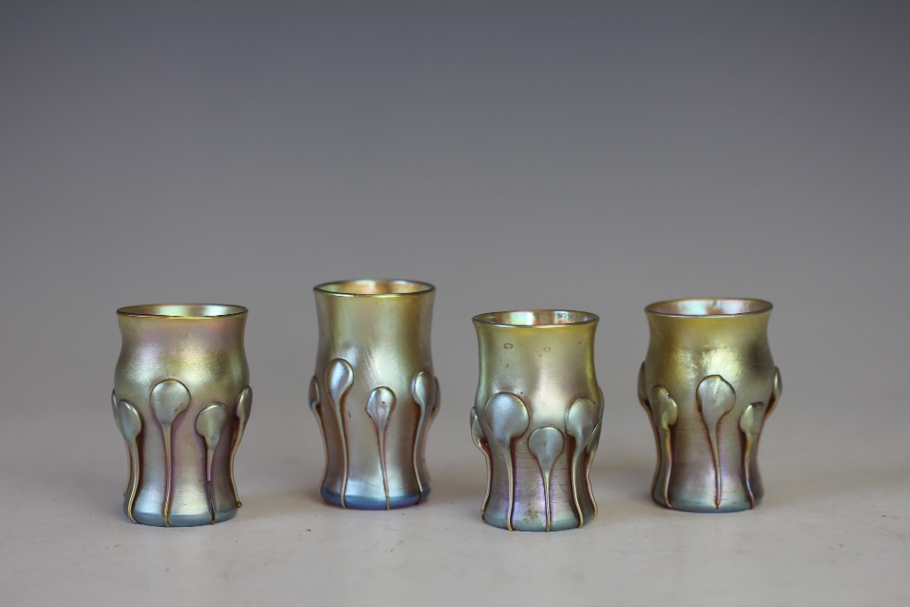 Four Tiffany Favrile iridescent glass liquor glasses, each with applied 'drip' glass detailing,