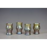 Four Tiffany Favrile iridescent glass liquor glasses, each with applied 'drip' glass detailing,