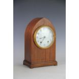 An Edwardian mahogany lancet shaped mantel clock, with enamel Arabic dial signed Seth Thomas,