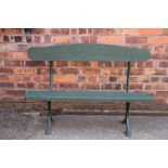 A cast iron garden bench, possibly a railway bench, with moulded frame,