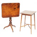 An early 19th century mahogany rectangular tilt top table, on tripod base,