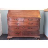 A George III mahogany bureau, with fall enclosing a fitted interior,