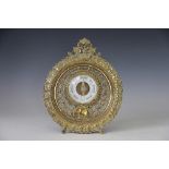 A Victorian pierced cast brass aneroid barometer, with elaborate circular frame,