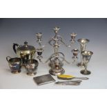 A selection of silver and plated wares to include; a three piece tea service, a trumpet vase,