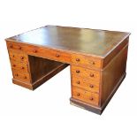 A late Victorian mahogany pedestal partners desk, with leather inset top,