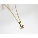 A diamond set 18ct yellow gold pendant and chain,