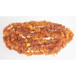 An amber bead necklace, 200cm long in a single strand, weight 54.