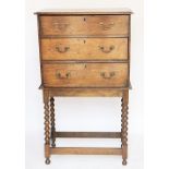 An 18th century and later oak chest on stand, with three graduated long drawers on bobbin legs,