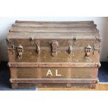 A vintage wooden and metal bound trunk, with internal tray and canvas interior, stamped 'A L',
