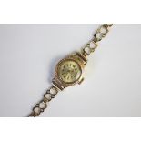 A lady's 9ct yellow gold wristwatch, Birmingham 1966, the circular dial with 12, 3,