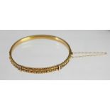 A Victorian 15ct yellow gold bangle,