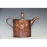 An Art Nouveau copper country house hot water can by Joseph Sankey, decorated with stylised flowers,