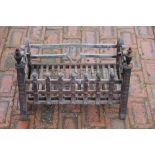A George III style cast iron fire grate, 50cm wide,
