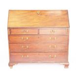 A George III mahogany bureau, with fall enclosing a fitted interior,