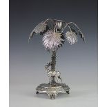 A WMF white metal table centrepiece, modelled as a stag standing beside a palm tree,