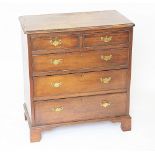 A George III and later mahogany straight front chest of two short and three long drawers,