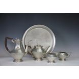 An English Pewter five piece tea service in Art Deco form and with planished finish,