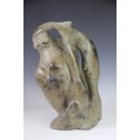 A Canadian Eskimo carved soapstone group 'Walrus / Whale / Fish', morphed as one, initialled verso.
