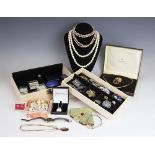 A quantity of jewellery, to include; a silver charm bracelet with attached charms, assorted beads,