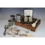 A pair of silver backed gentleman's brushes and a comb, along with a selection of cutlery,