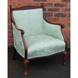 A Victorian carved walnut show frame salon chair, with Art Nouveau style green upholstery,