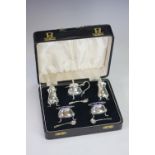 A cased silver condiment set, William Suckling, Birmingham 1937 and 1938, comprising; two mustards,