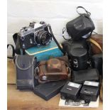 An assortment of cameras to include a Chinon with Tomioka lens amd a Consina CT-1